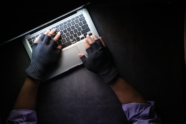 hands typing on laptop